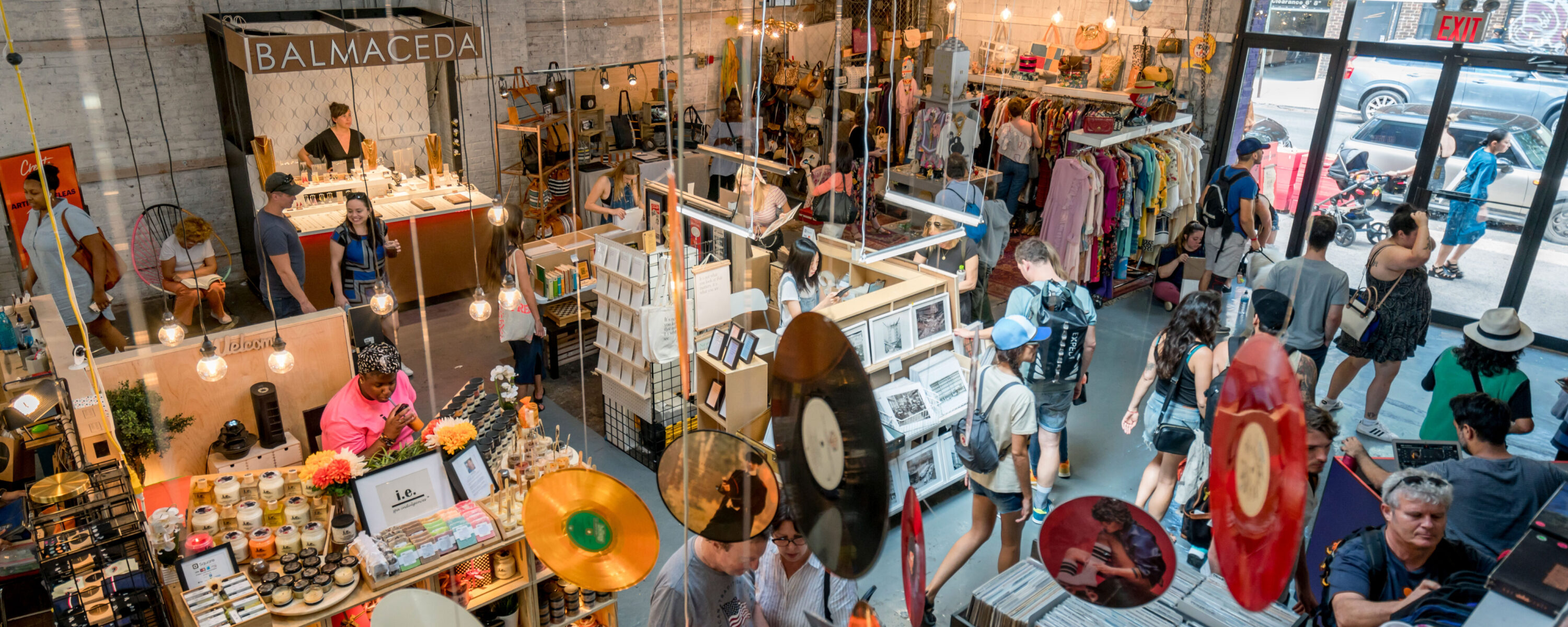 Shoppers visit the Williamsburg Artists & Fleas Market