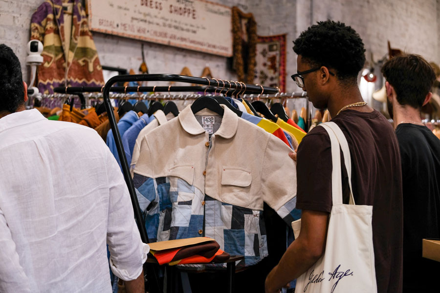 Shopper browses ONE432 custom apparel in NYC
